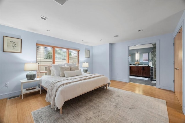 1821 Merriman, South Side, PA 15203 - bedroom with light wood-style floors, ensuite bath, and beverage cooler