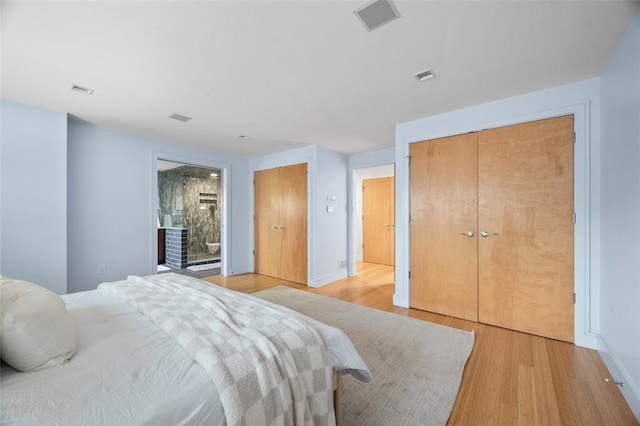 1821 Merriman, South Side, PA 15203 - bedroom featuring light wood finished floors and multiple closets