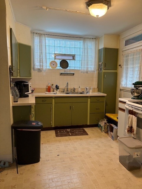 603 Whitney, Wilkinsburg, PA 15221 - kitchen featuring green cabinetry, white range with electric stovetop, light countertops, and decorative backsplash