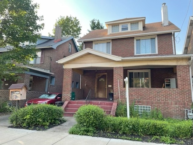 603 Whitney, Wilkinsburg, PA 15221 - american foursquare style home with brick siding, a porch, and a chimney