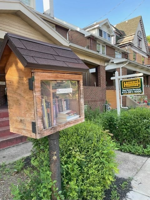 603 Whitney, Wilkinsburg, PA 15221 - view of exterior entry with brick siding and a shingled roof