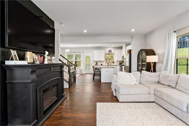 4002 Saint Andrews Ct, Penn Twp Wml, PA 15644 - living area with dark wood-style flooring, a glass covered fireplace, and recessed lighting