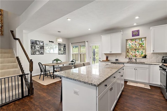 4002 Saint Andrews Ct, Penn Twp Wml, PA 15644 - kitchen with dark wood-type flooring, light stone counters, backsplash, recessed lighting, and white cabinets