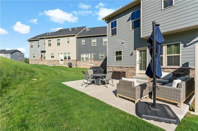 4002 Saint Andrews Ct, Penn Twp Wml, PA 15644 - rear view of property with an outdoor living space, a patio area, a lawn, a residential view, and stone siding