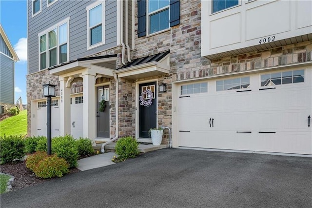 4002 Saint Andrews Ct, Penn Twp Wml, PA 15644 - entrance to property with stone siding, a garage, and driveway