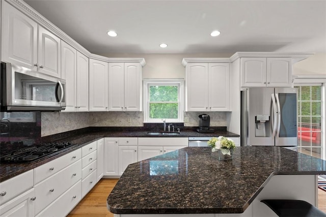 7052 Bennington Woods Dr, Mccandless, PA 15237 - kitchen featuring stainless steel appliances, healthy amount of natural light, dark stone counters, decorative backsplash, and recessed lighting