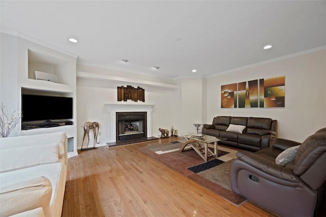 7052 Bennington Woods Dr, Mccandless, PA 15237 - living room featuring ornamental molding, wood finished floors, recessed lighting, and a fireplace with raised hearth