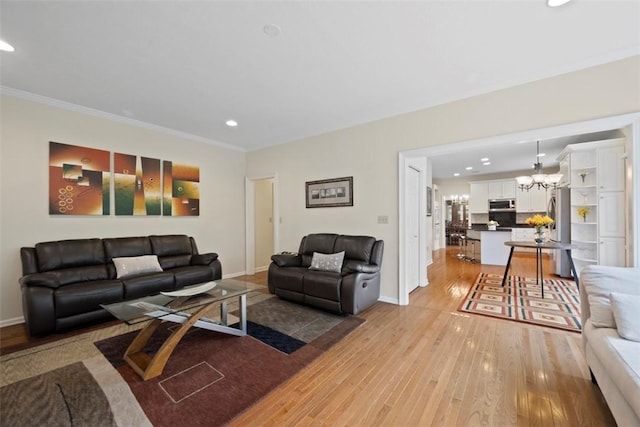 7052 Bennington Woods Dr, Mccandless, PA 15237 - living room with recessed lighting, light wood-type flooring, a chandelier, and ornamental molding