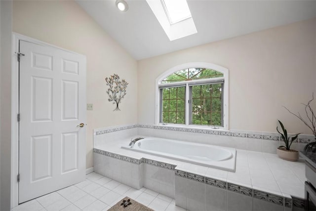 7052 Bennington Woods Dr, Mccandless, PA 15237 - bathroom featuring a skylight, a garden tub, lofted ceiling, and tile patterned floors