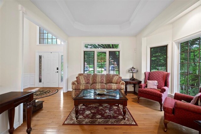 7052 Bennington Woods Dr, Mccandless, PA 15237 - living room with healthy amount of natural light, a raised ceiling, wood finished floors, and ornamental molding