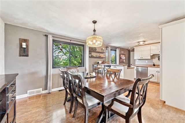 4047 Crestwood Dr, West Deer, PA 15044 - dining room featuring a chandelier and light wood-style floors