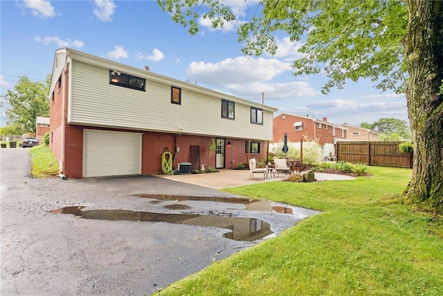 4047 Crestwood Dr, West Deer, PA 15044 - rear view of house featuring a garage, a patio area, and driveway