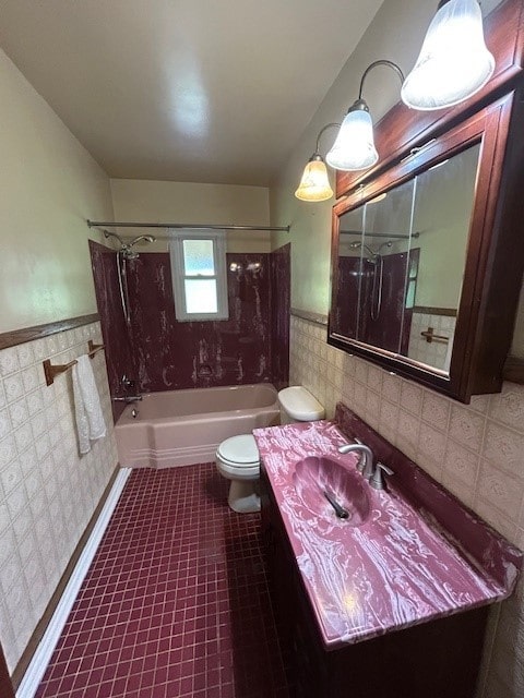 300 6th Ave, New Eagle, PA 15067 - bathroom with tile walls, bathing tub / shower combination, vanity, and a wainscoted wall