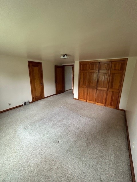 300 6th Ave, New Eagle, PA 15067 - unfurnished bedroom with light carpet and two closets