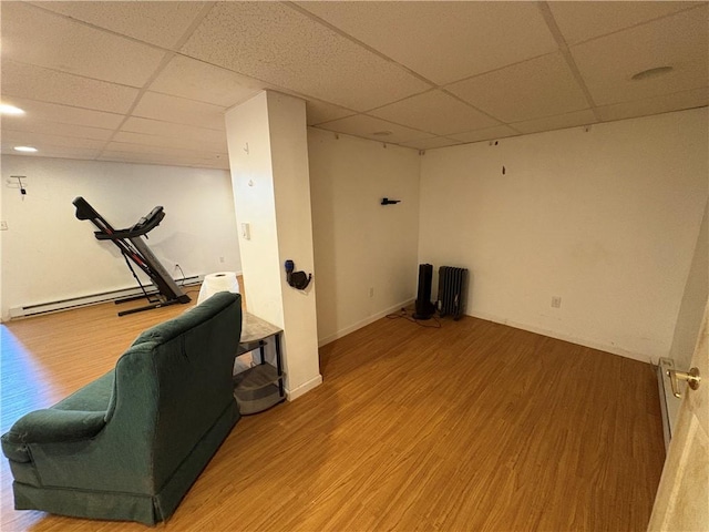 114 Cardinal Rd, Canoe/Banks Twps, PA 15742 - exercise area featuring a drop ceiling, wood finished floors, a baseboard heating unit, and radiator