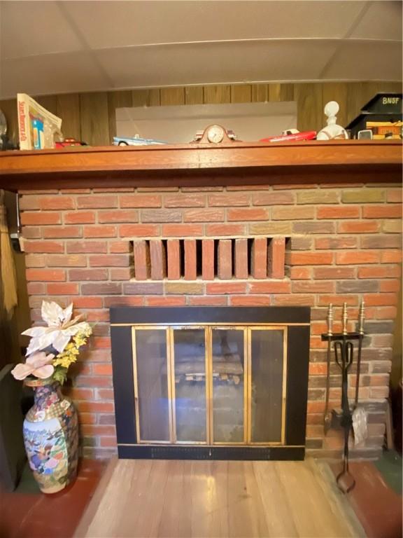 371 Leech Rd, Sugar Grove Twp, PA 16125 - detailed view of a brick fireplace and wood finished floors