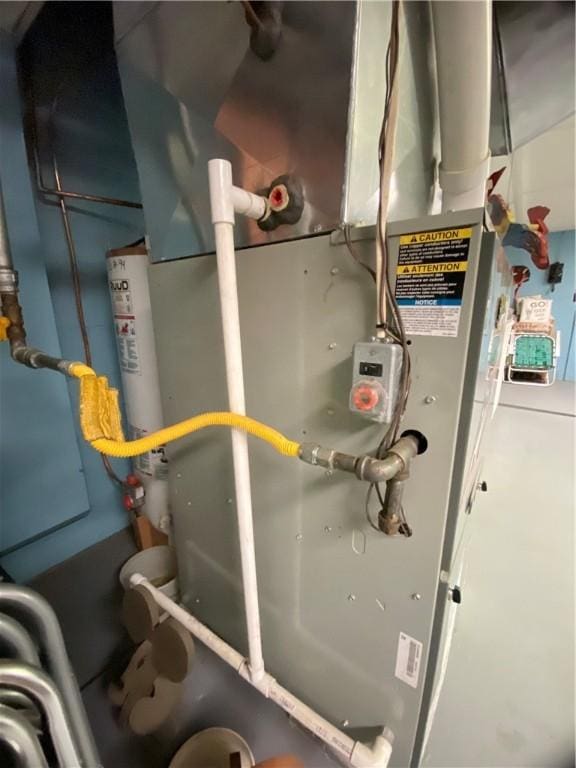 371 Leech Rd, Sugar Grove Twp, PA 16125 - utility room featuring heating unit