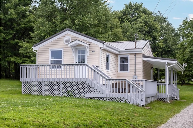 466 Braden School Rd, Chippewa Twp, PA 15010 - view of front facade featuring a front yard, view of wooded area, and a metal roof