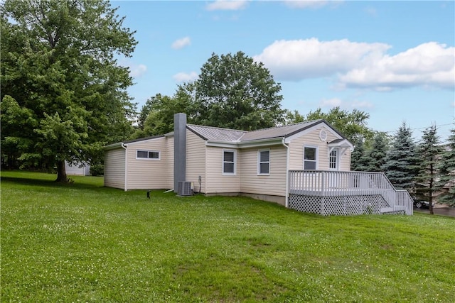 466 Braden School Rd, Chippewa Twp, PA 15010 - back of house with a lawn, a deck, a chimney, and a metal roof