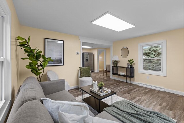466 Braden School Rd, Chippewa Twp, PA 15010 - living area featuring baseboard heating and wood finished floors