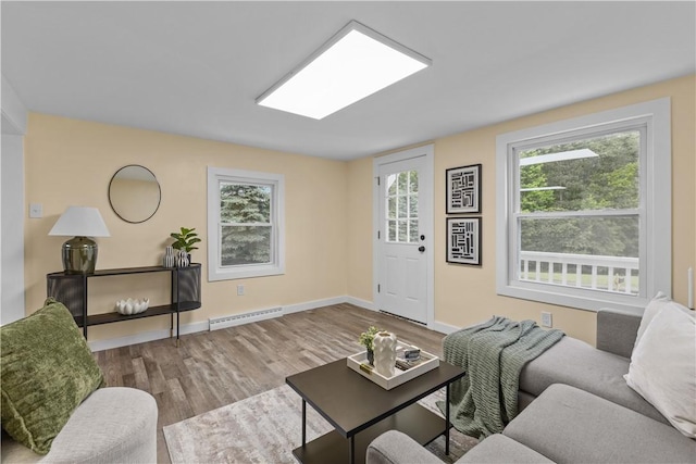 466 Braden School Rd, Chippewa Twp, PA 15010 - living room with a baseboard heating unit and wood finished floors