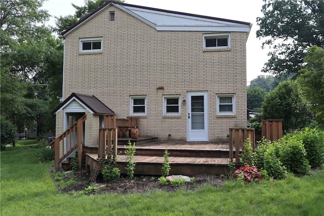 925 Dixon Rd, Cherryhll Twp/Clymer, PA 15728 - rear view of property with a wooden deck, brick siding, and a lawn