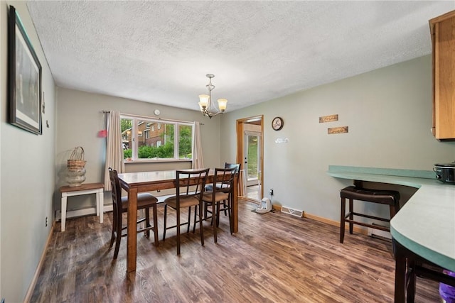 119 Taylor Rd, Quemahoning Twp, PA 15541 - dining area with dark wood-type flooring, a chandelier, and a textured ceiling