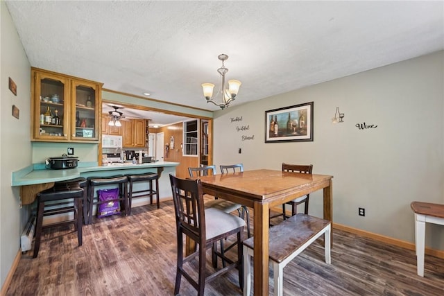 119 Taylor Rd, Quemahoning Twp, PA 15541 - dining room featuring dark wood finished floors, a chandelier, and a textured ceiling
