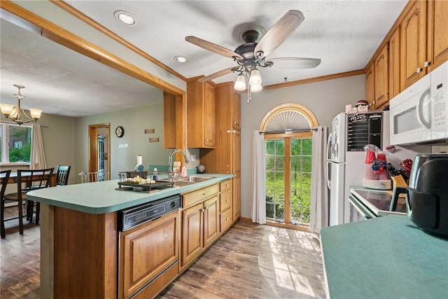 119 Taylor Rd, Quemahoning Twp, PA 15541 - kitchen with paneled dishwasher, white microwave, plenty of natural light, a peninsula, and recessed lighting