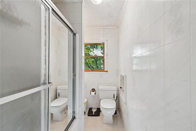 119 Taylor Rd, Quemahoning Twp, PA 15541 - full bath with tile walls, a stall shower, a textured ceiling, tile patterned floors, and ornamental molding