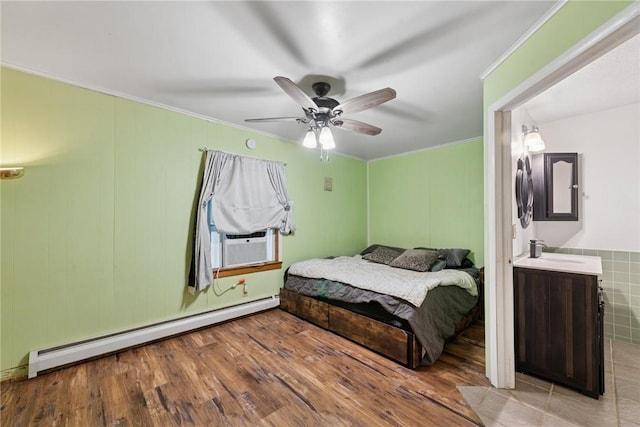119 Taylor Rd, Quemahoning Twp, PA 15541 - bedroom with a baseboard heating unit, cooling unit, ornamental molding, ceiling fan, and wood finished floors