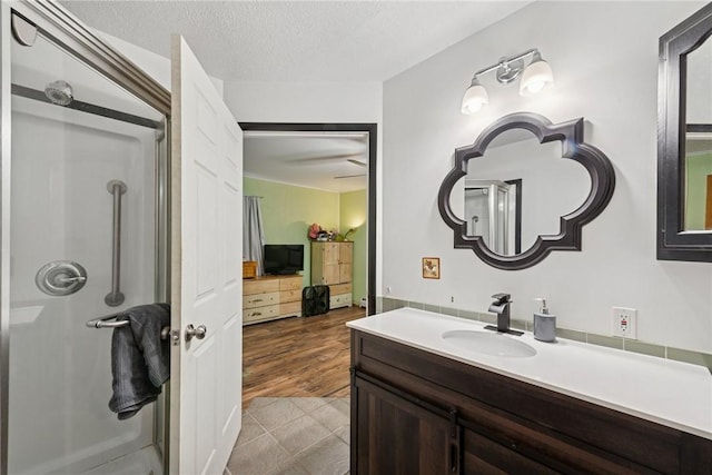 119 Taylor Rd, Quemahoning Twp, PA 15541 - bathroom featuring a shower stall, vanity, and a textured ceiling