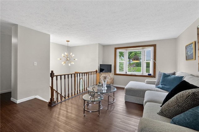 1304 Greenhill Road Ext, Shaler, PA 15209 - living area with a chandelier, wood finished floors, and a textured ceiling