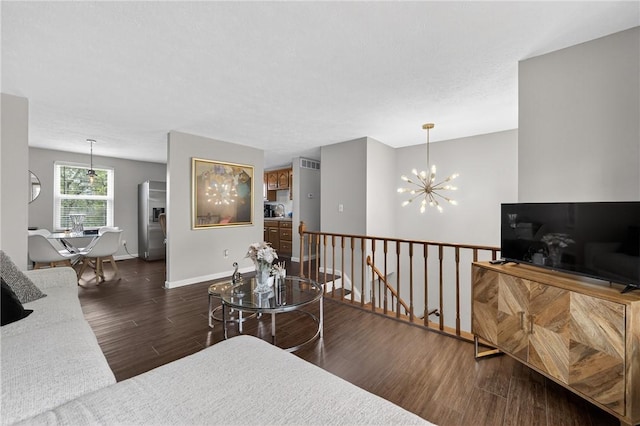 1304 Greenhill Road Ext, Shaler, PA 15209 - living room featuring wood finished floors and a chandelier