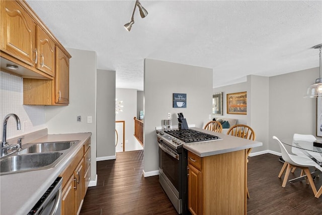 1304 Greenhill Road Ext, Shaler, PA 15209 - kitchen featuring gas range, a textured ceiling, dishwashing machine, dark wood-type flooring, and light countertops