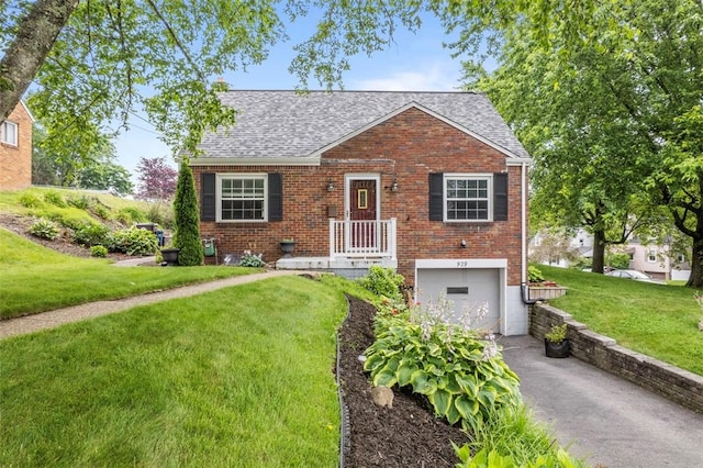 929 Edward Dr, Baldwin Boro, PA 15227 - view of front of home with an attached garage, driveway, brick siding, a front yard, and a shingled roof