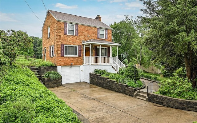 9916 Neuhart Blvd, Mccandless, PA 15090 - american foursquare style home with a chimney, covered porch, driveway, an attached garage, and brick siding
