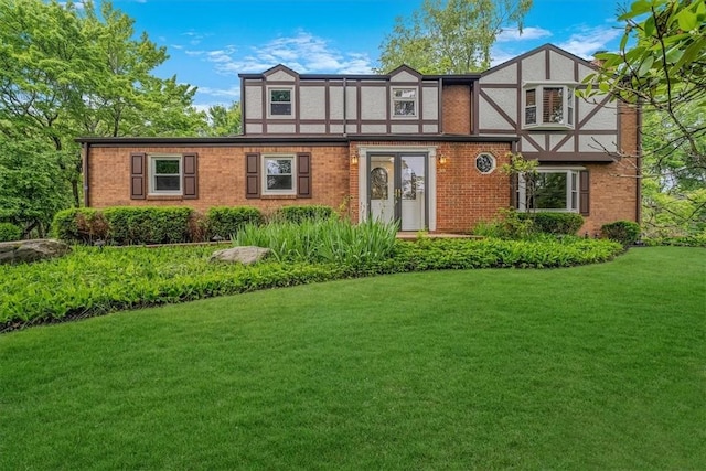 38 Easton Rd, Fox Chapel, PA 15238 - tudor house with a front lawn and brick siding