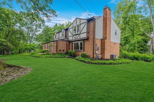 38 Easton Rd, Fox Chapel, PA 15238 - rear view of house featuring a chimney, a lawn, and brick siding
