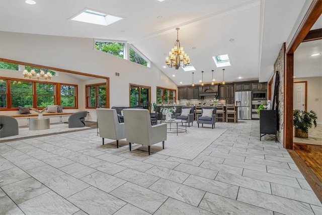 38 Easton Rd, Fox Chapel, PA 15238 - dining room with a skylight, a chandelier, light marble finish floors, and high vaulted ceiling