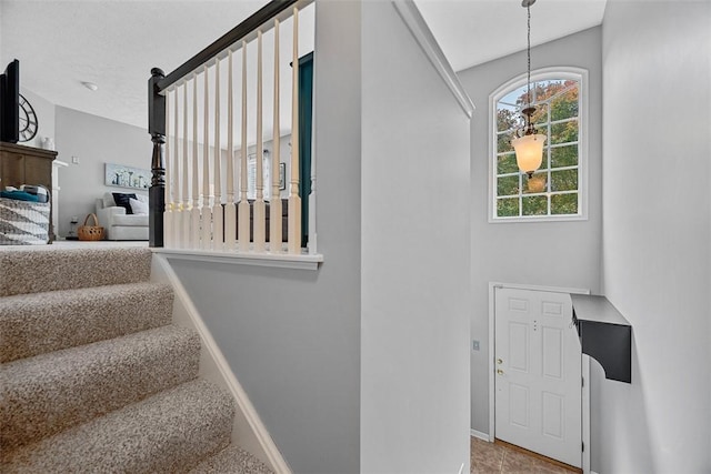 81406 Lost Valley Dr, Adams Twp, PA 16046 - stairs with baseboards and a chandelier