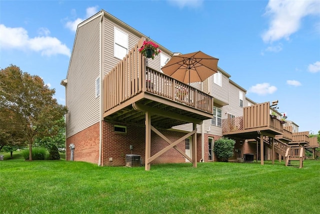 81406 Lost Valley Dr, Adams Twp, PA 16046 - back of property with brick siding, a deck, and a yard