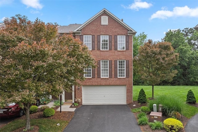 81406 Lost Valley Dr, Adams Twp, PA 16046 - view of front of house featuring asphalt driveway, brick siding, an attached garage, and a front yard
