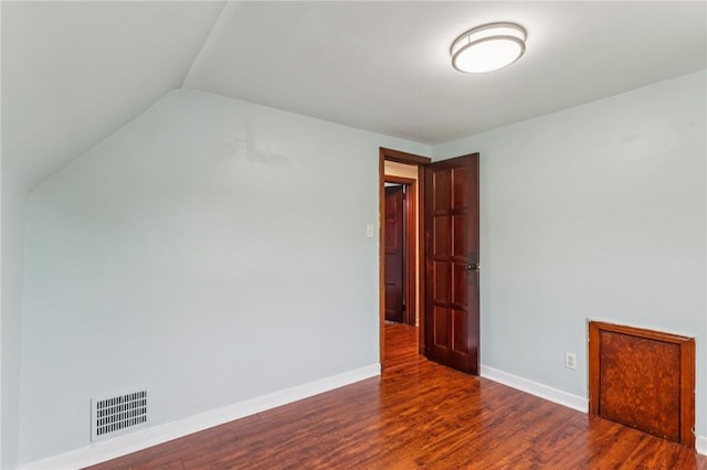 1027 Goldenrod St, Homestead, PA 15120 - empty room featuring wood finished floors and vaulted ceiling