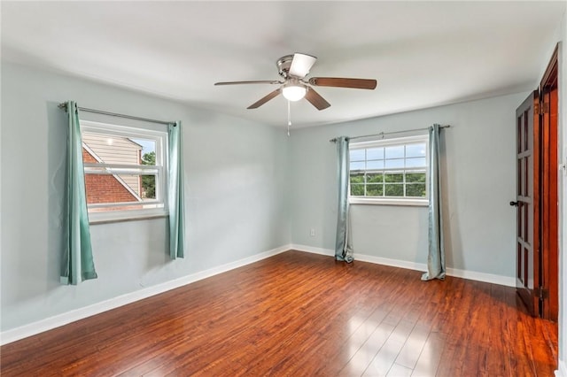 1027 Goldenrod St, Homestead, PA 15120 - empty room with dark wood-style floors and a ceiling fan