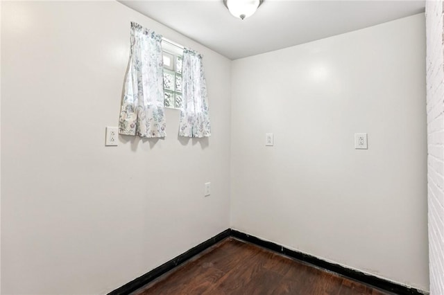 1027 Goldenrod St, Homestead, PA 15120 - empty room with dark wood-type flooring and baseboards