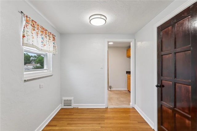 1027 Goldenrod St, Homestead, PA 15120 - empty room featuring light wood-style floors and baseboards