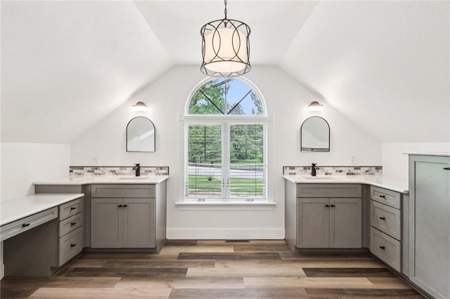 3442 Mercer Rd, Neshannock Twp, PA 16105 - bathroom featuring backsplash, vaulted ceiling, two vanities, and wood finished floors