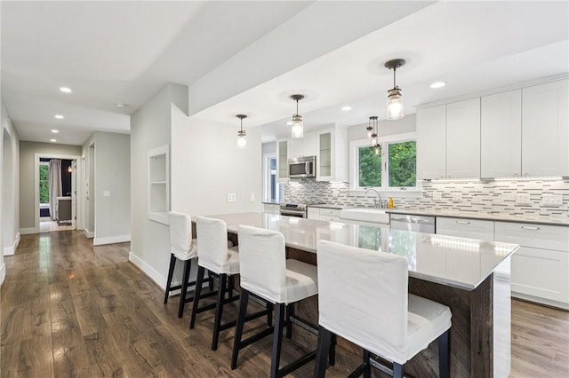 3442 Mercer Rd, Neshannock Twp, PA 16105 - kitchen featuring appliances with stainless steel finishes, decorative backsplash, white cabinetry, dark wood-style floors, and recessed lighting
