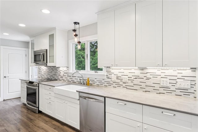 3442 Mercer Rd, Neshannock Twp, PA 16105 - kitchen featuring appliances with stainless steel finishes, white cabinetry, light stone countertops, recessed lighting, and backsplash